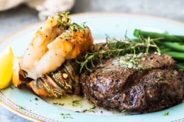 Surf and turf on a blue plate.