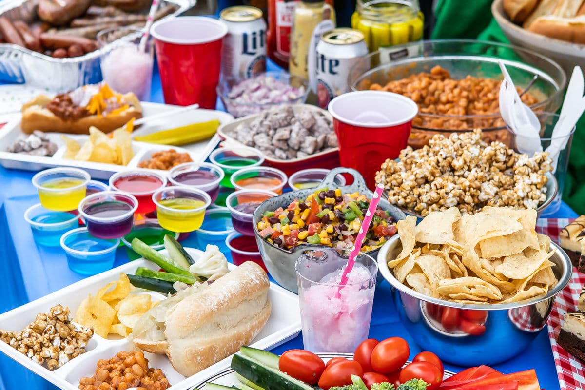 A tailgating spread set up at the back of a car.