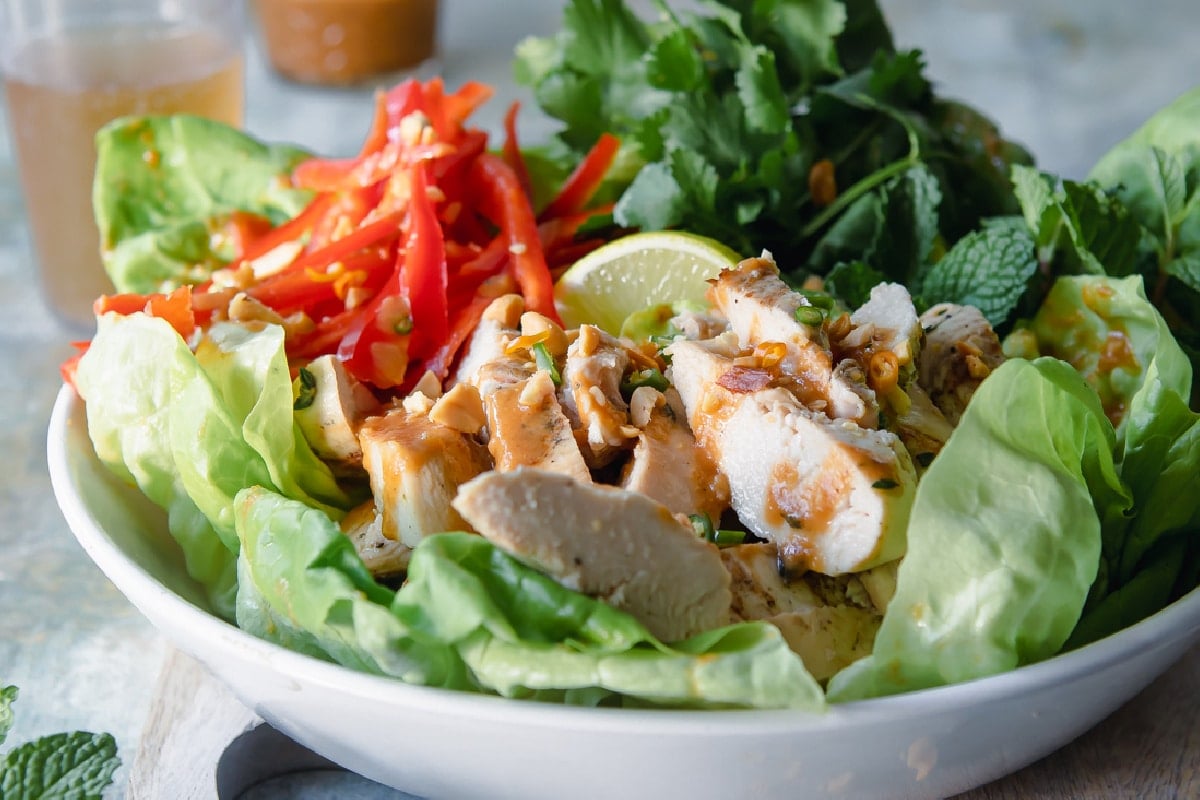 A Thai Chicken Salad in a white bowl.