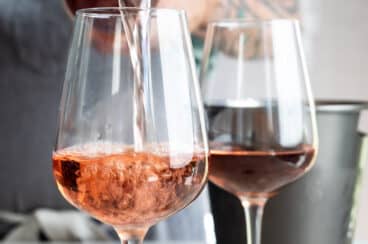 Rosé wine being poured into a glass.